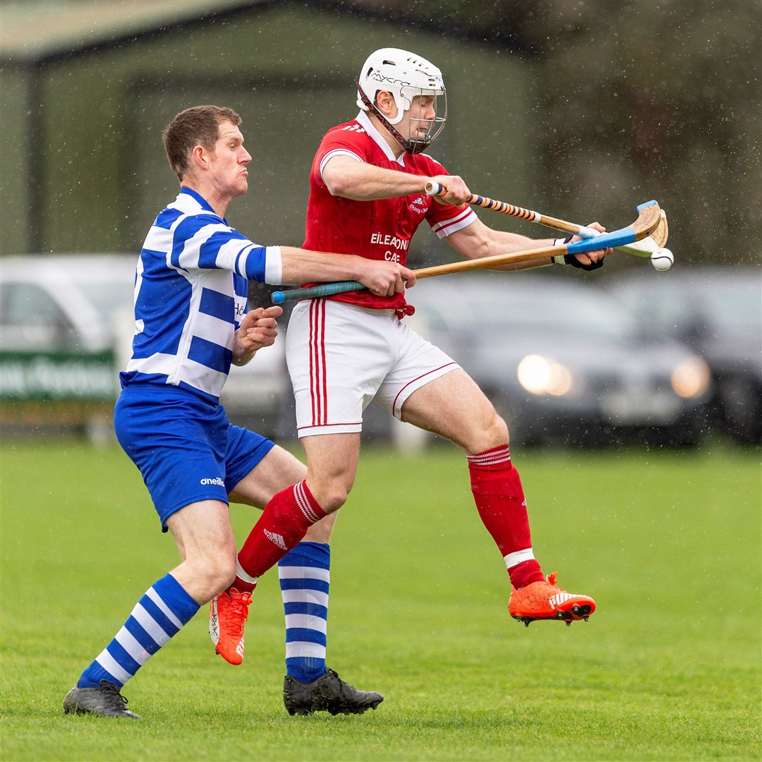 Fraser Mackintosh (left) in action for Newtonmore in the MacAulay Cup first round at The Eilan.