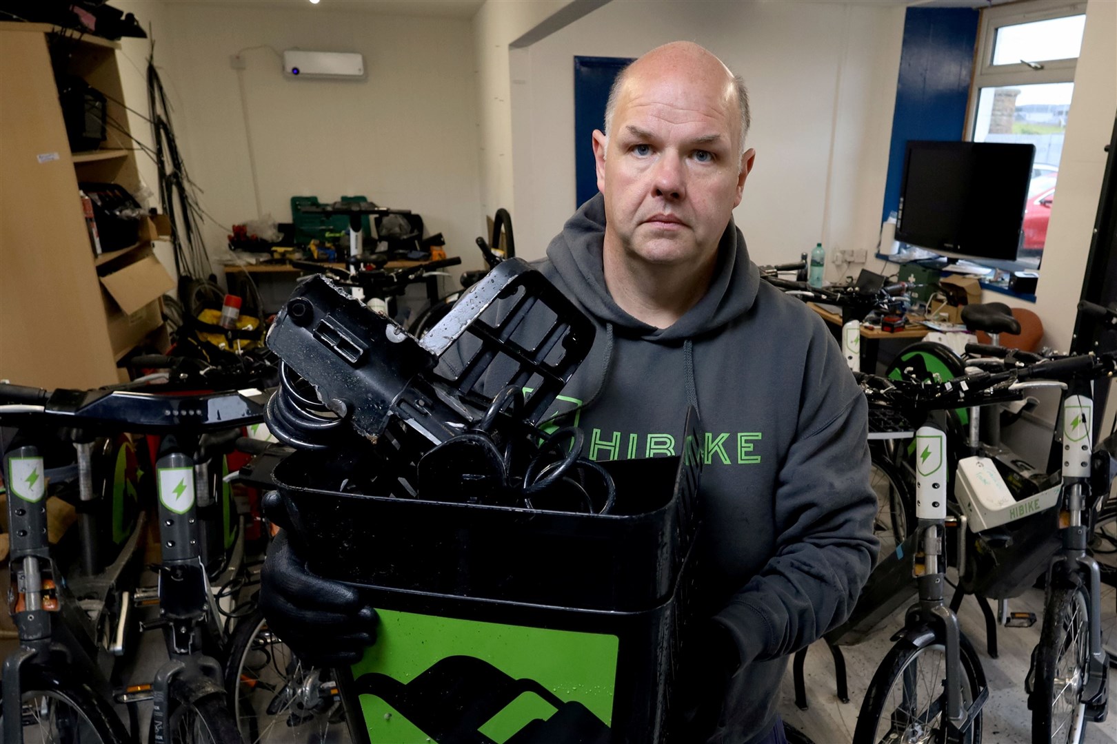 Ian Mackenzie, Bike Mechanic, holding broken Hi-Bike baskets. Picture: James Mackenzie