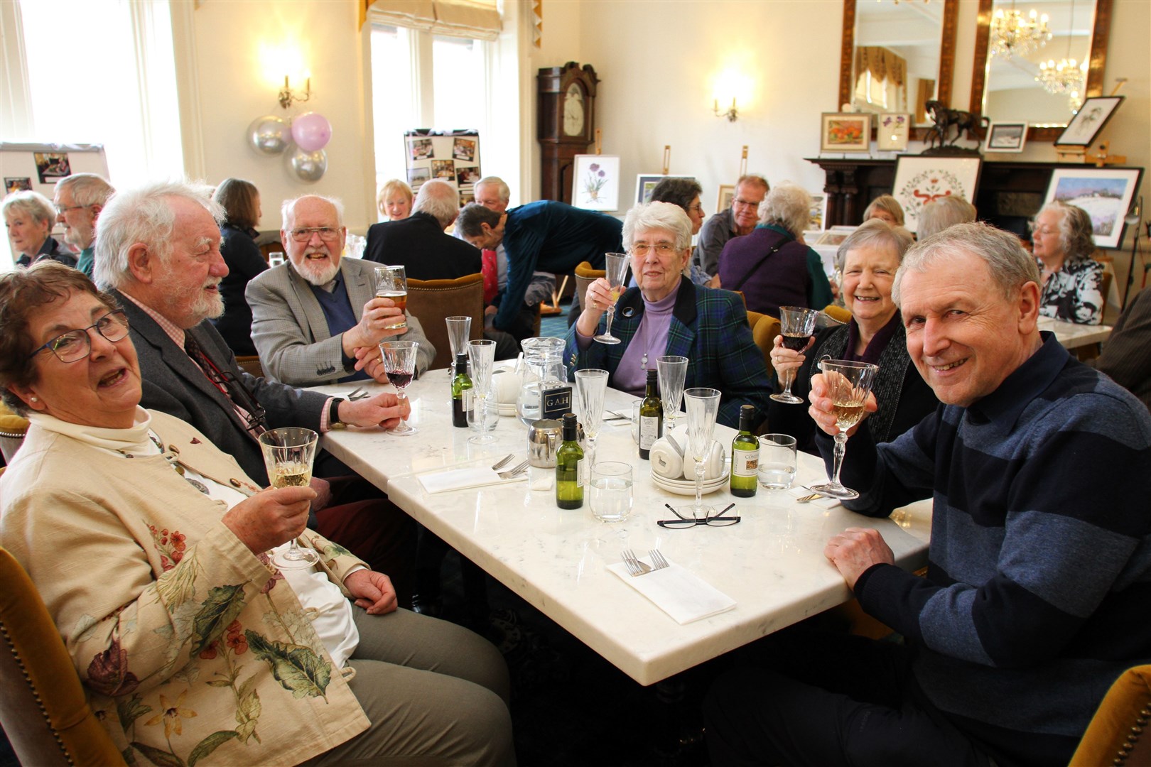 Cheeers to Grantown u3a! Sue Sykes, Ian Sykes, Bill Steele, Joan Steele, Elspeth Sage and Graham Sage enjoy the get-together.