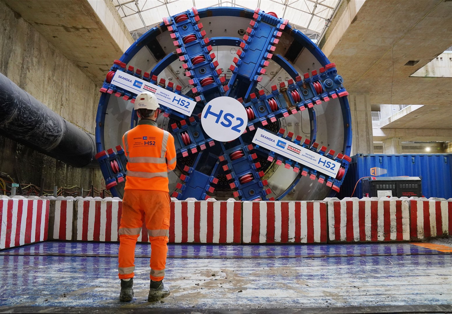 An HS2 worker standing in front of tunnel boring machine Karen at the Old Oak Common station box site (Jonathan Brady/PA)