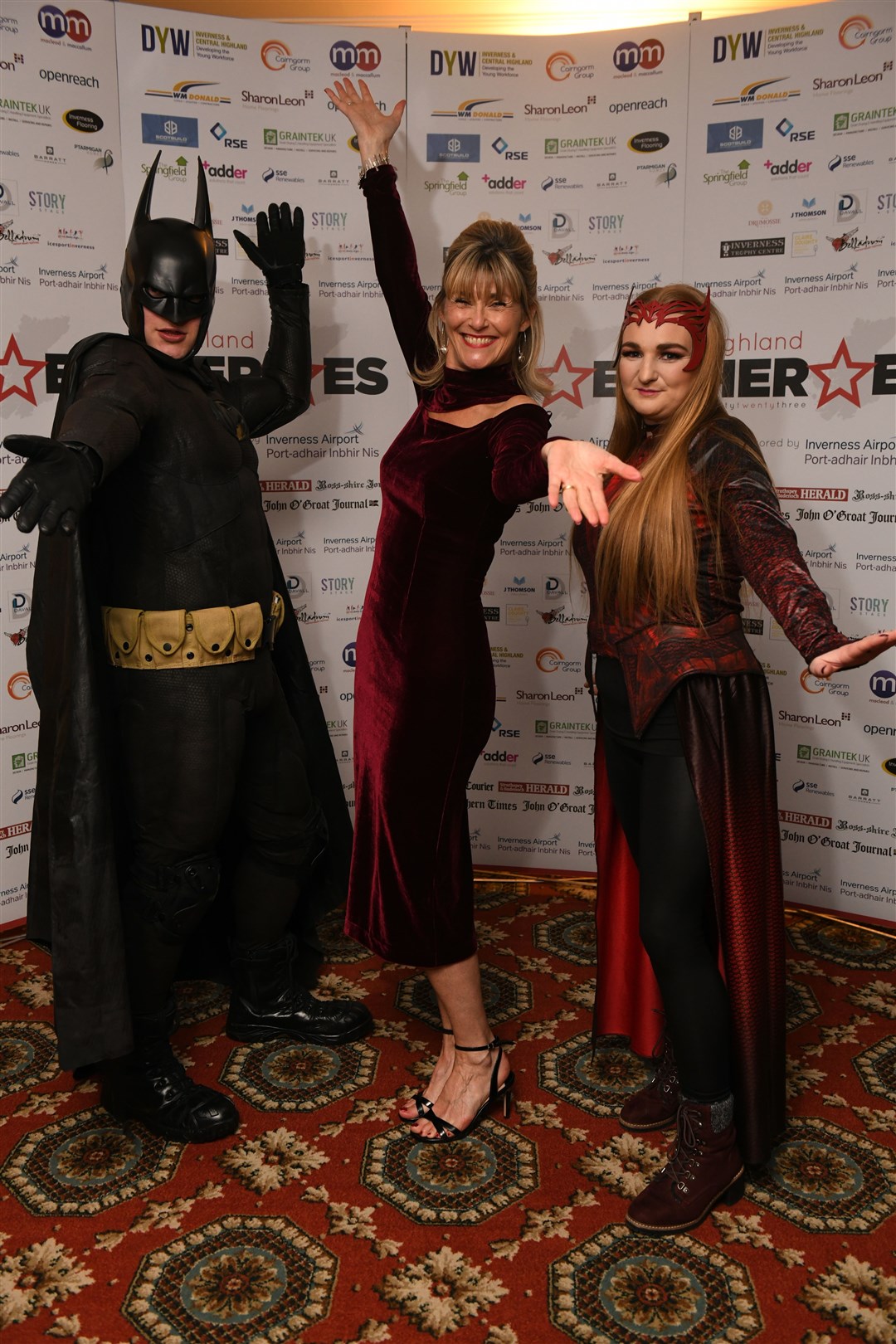 Event host Nicky Marr (centre) with superhero guests. Picture: James Mackenzie