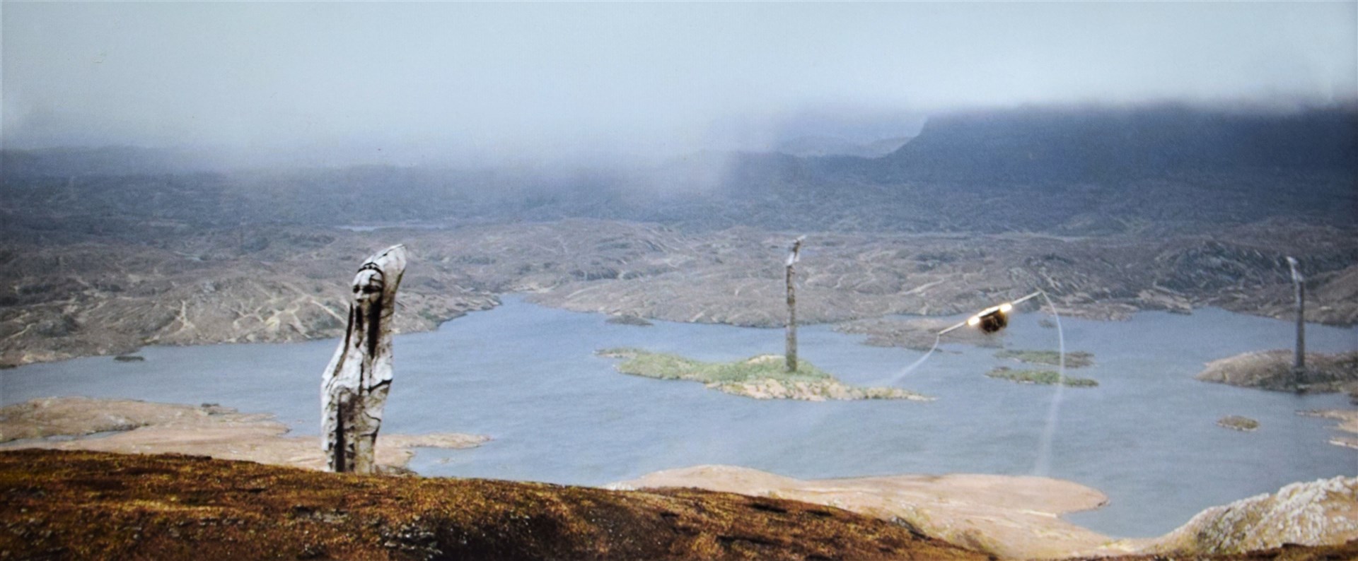 A shuttle flies over the waters of Loch Sionasgaig, with a few giant statues adding some CGI flourishes to the shot. Picture: ©2023 Lucasfilm Ltd. & TM. All Rights Reserved.