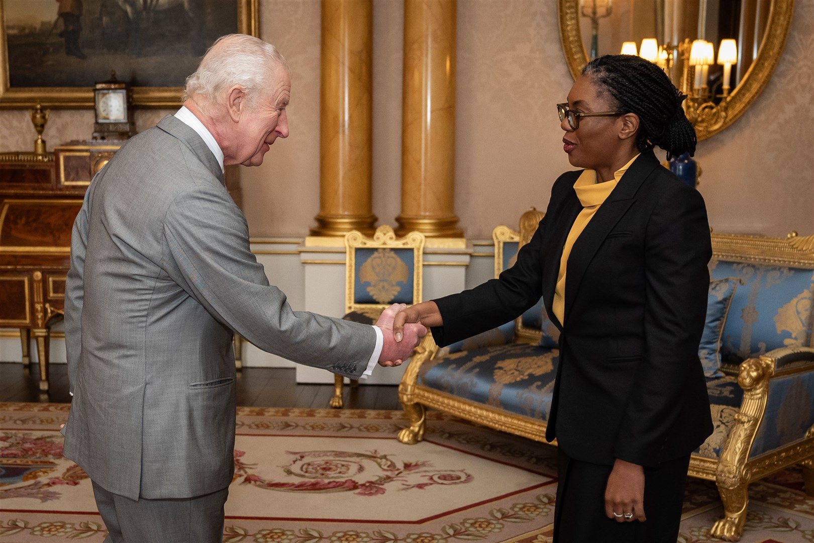 The King and Kemi Badenoch shake hands at the start of the audience (Aaron Chown/PA)