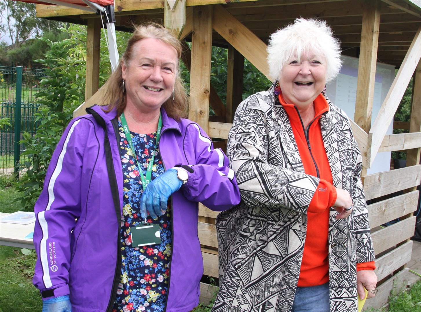 Given the elbow? Not exactly! Jean's just playing it safe with her one-time head teacher Rona Smith, as requested by government guidelines!