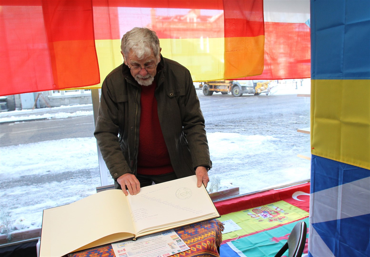 COME AND SIGN IN: Bill Sadler with the international book at the Hub which is available all weekend. Picture: Frances Porter.