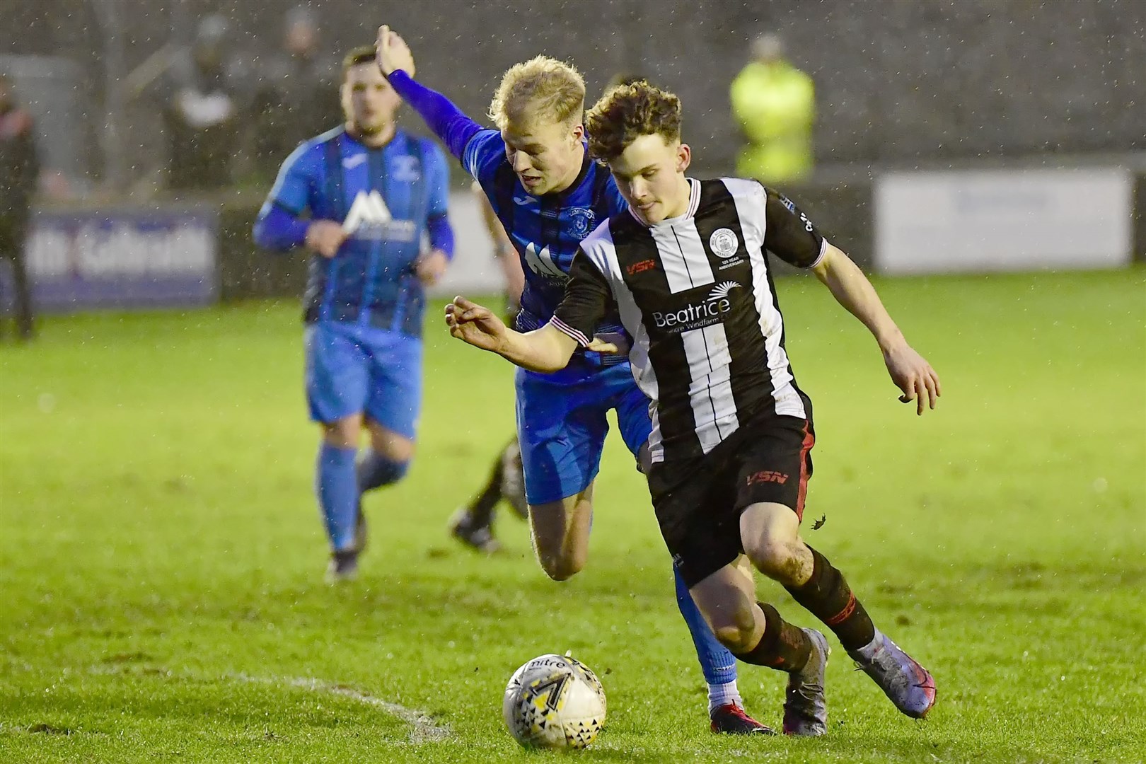 Strathspey's Ashley Ballam challenges Wick's Mark Munro in the Jags 1-0 defeat at Harmsworth Park in mid-December.