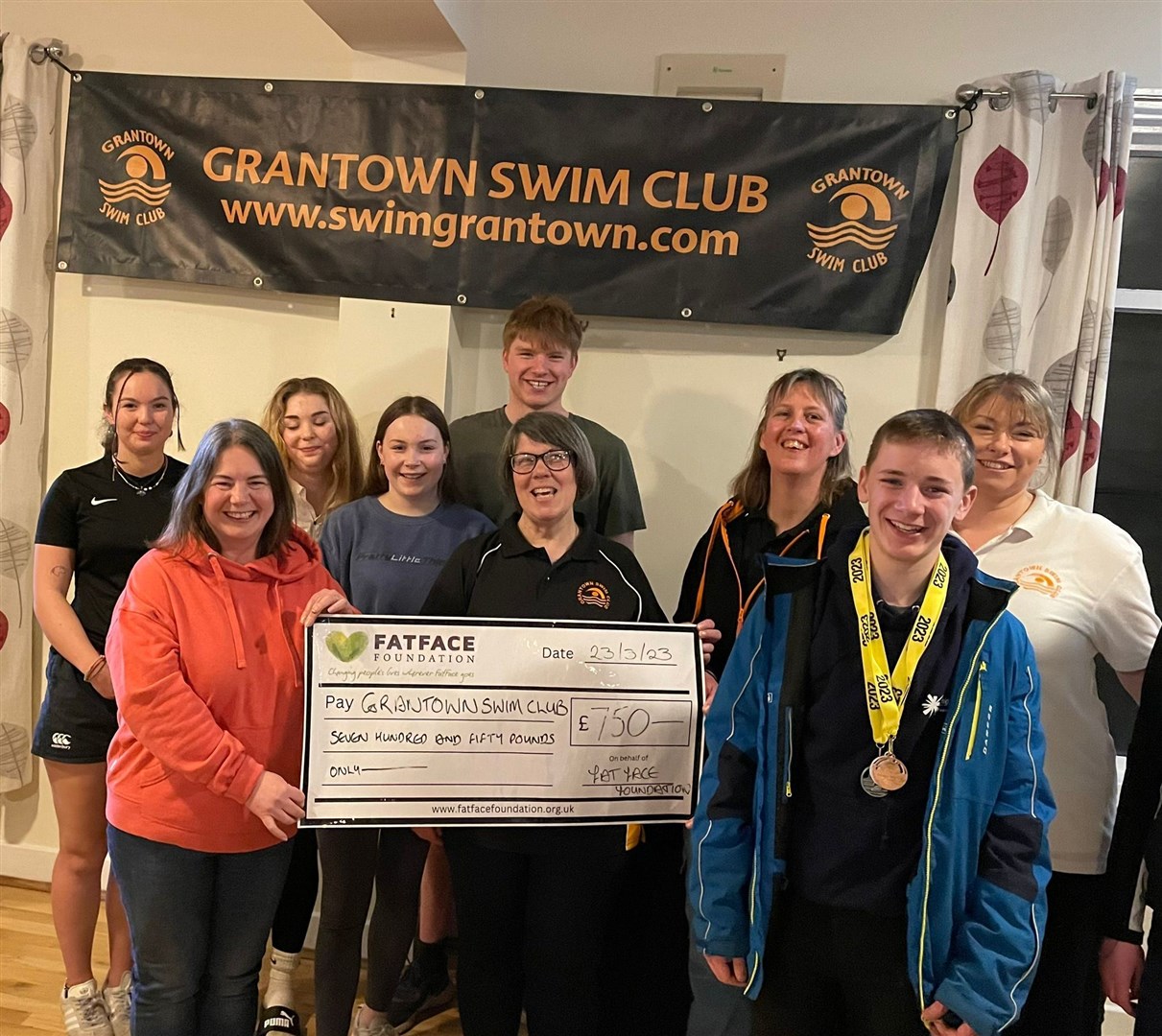 At the presentation are (front) Judy Burke, Kathryn Talbot-Heigh, Gregor Bateman; (back) Danielle McMaster, Lucy-Ella McMaster, Holly Corcoran, Andrew Murphie, Cath Moore and Amy Murphie.