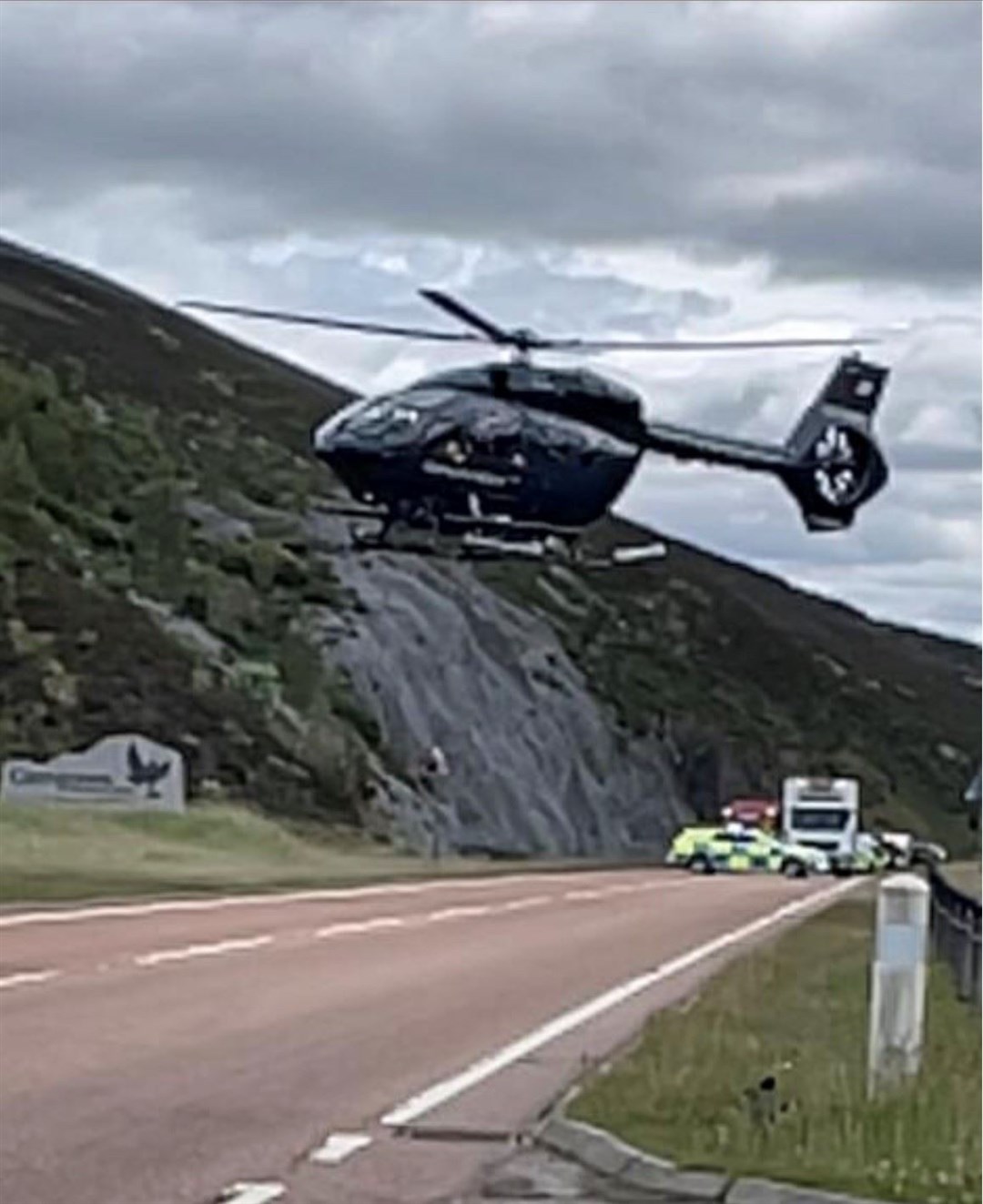 A helicopter leaving the crash site at 2pm.
