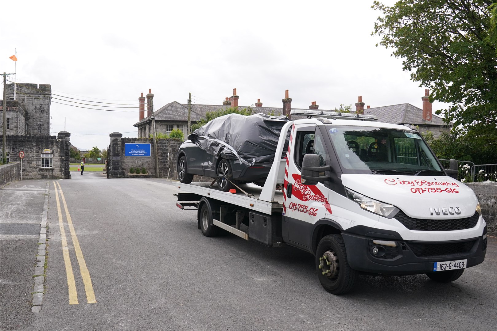 The car being removed from the scene (Brian Lawless/PA)