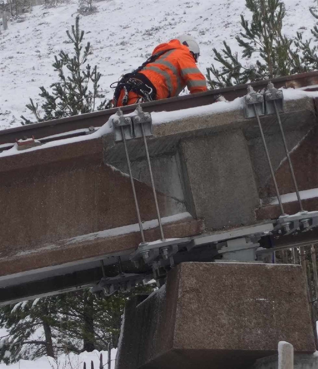 The Repair: a workman this week getting on the huge task of getting the funicular running normally once more.