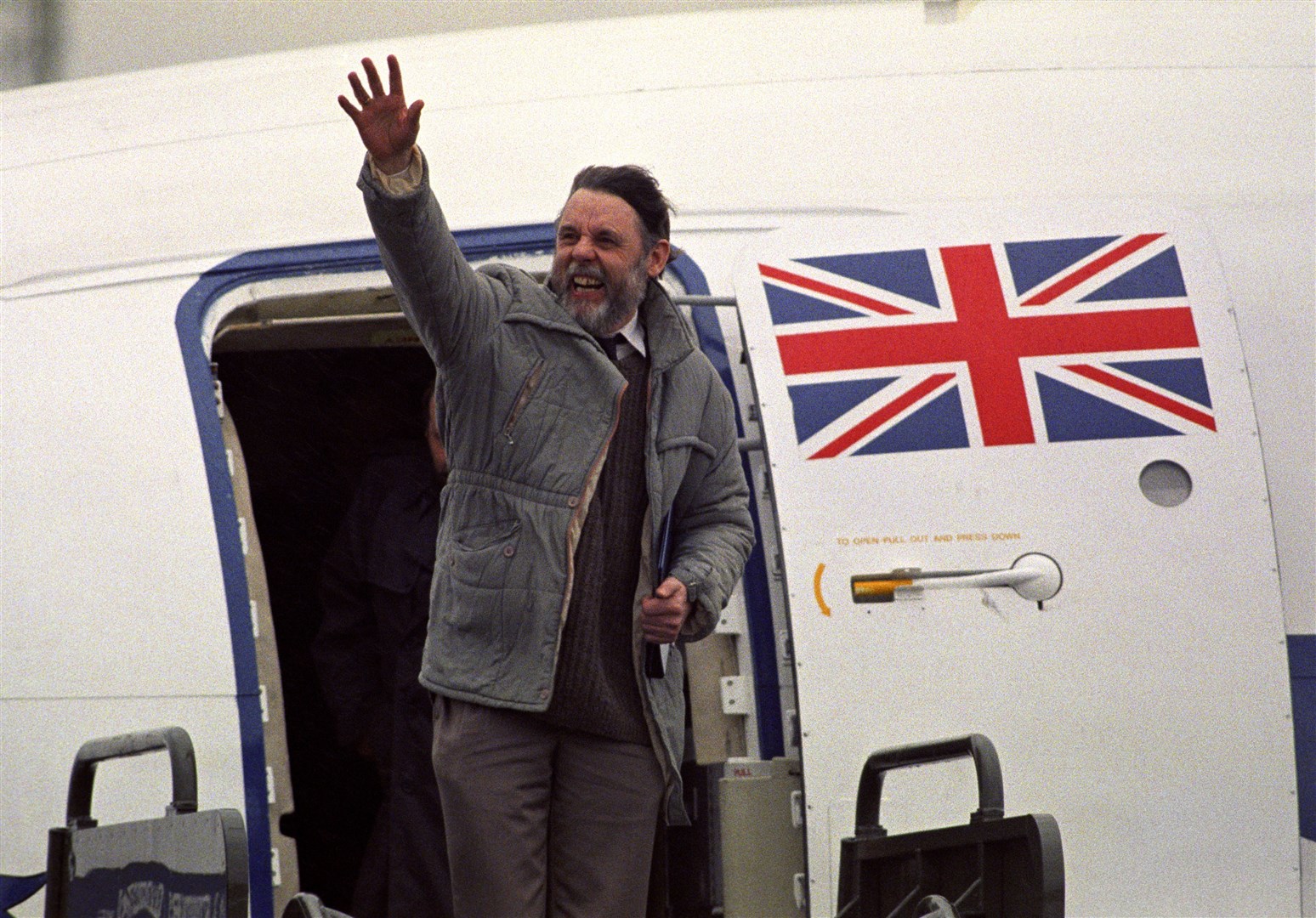Freed middle east hostage and representative of the Archbishop of Canterbury, Terry Waite, arrives at RAF Lyneham after being freed in 1991 (Barry Batchelor/PA)