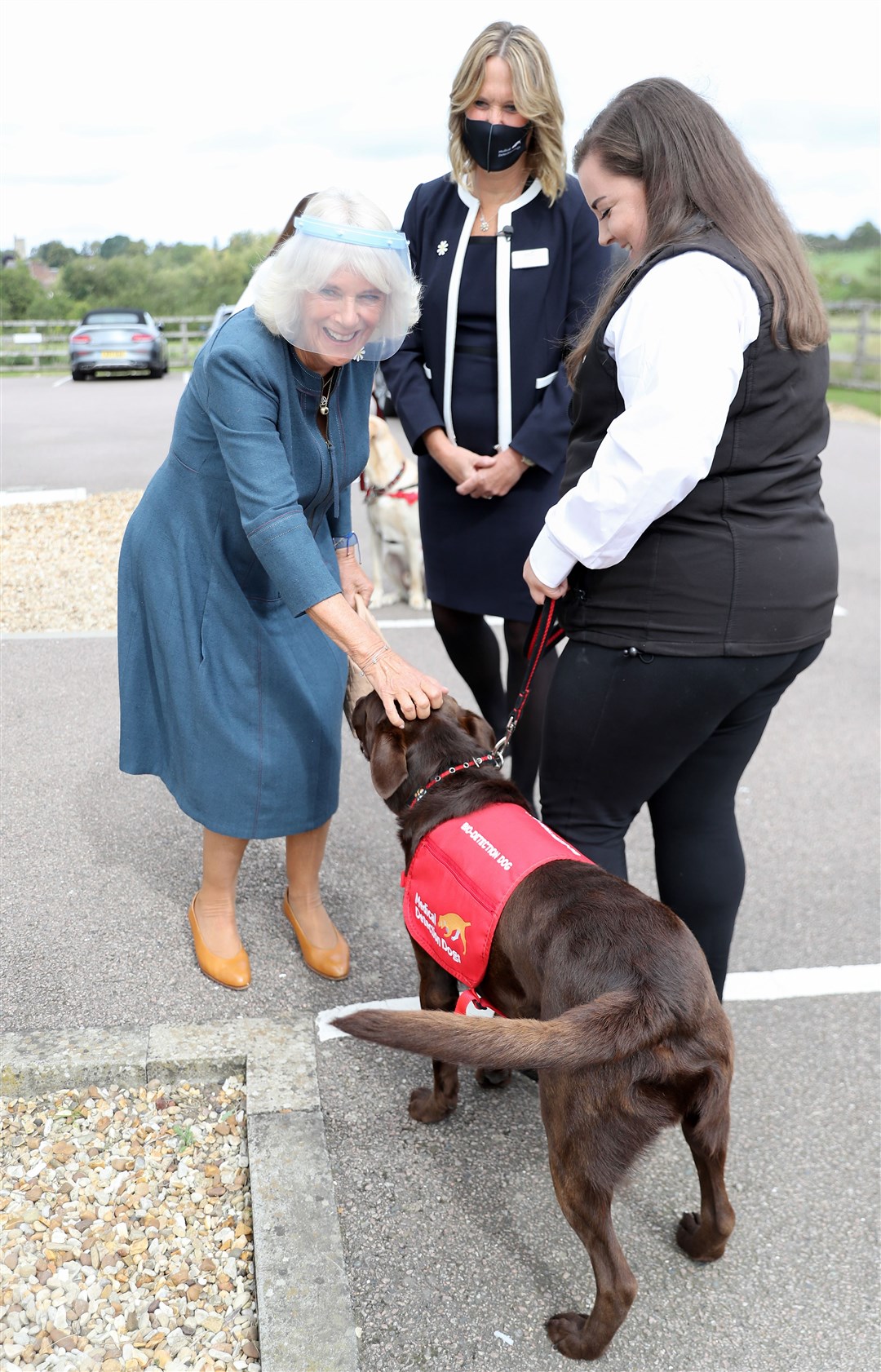 The Duchess of Cornwall meets Basil the Labrador at the training centre (Chris Jackson/PA)