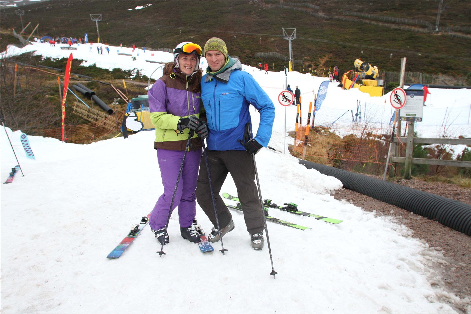 Helen and Simon Coker, from Boat of Garten, on the opening day of the new ski season on Saturday. Ski bosses want to re-profile the lower slopes partly pictured in the background.