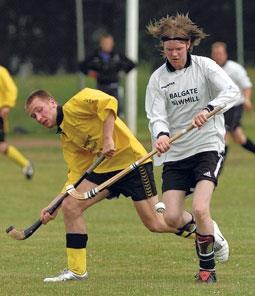 Lovat's Sandy MacAulay (right) comes under pressure from Bryan Simpson of Fort William in last weekend's match.