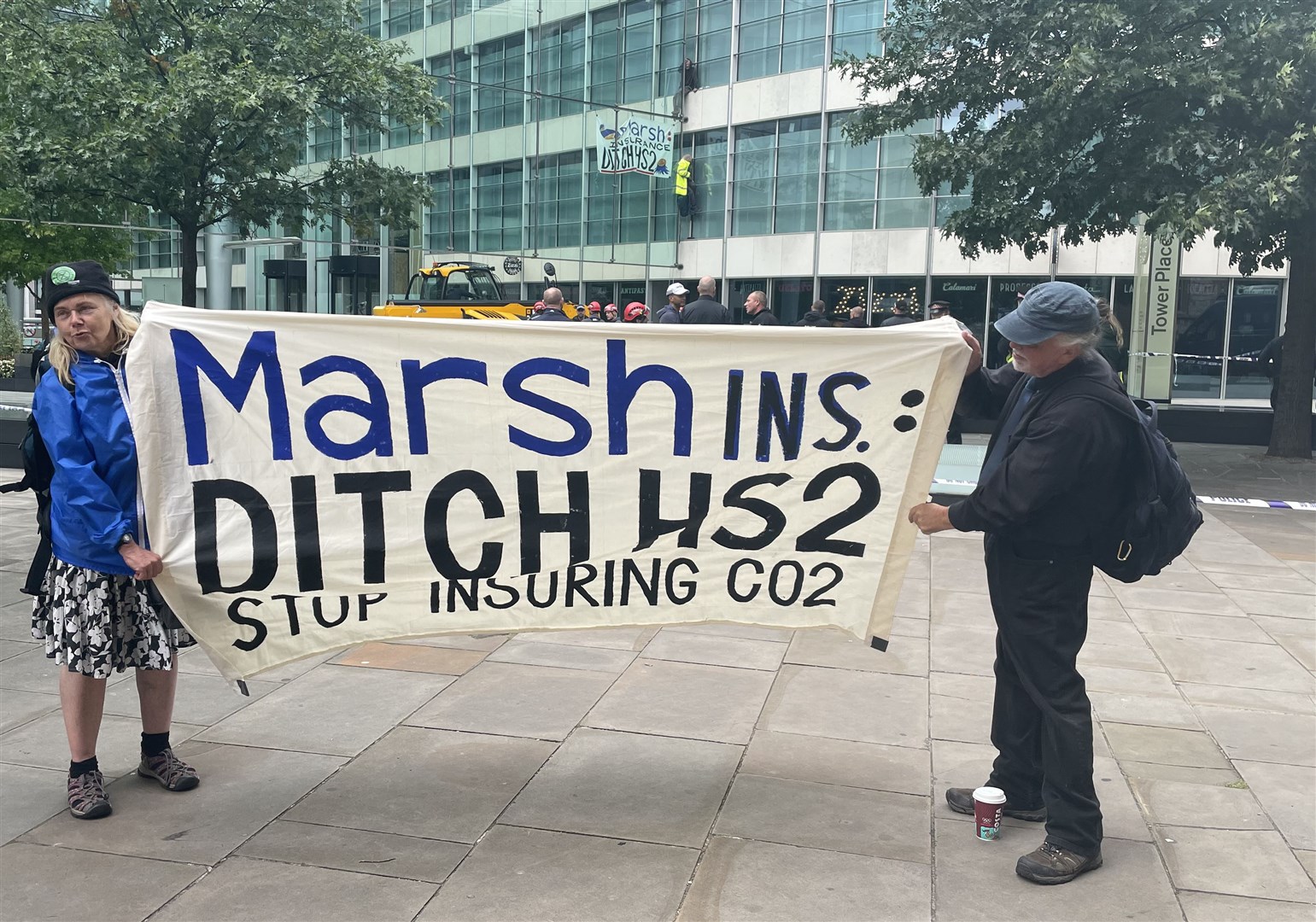 Demonstrators scaled the Tower Place West building in central London (Elmira Tanatarova/PA)