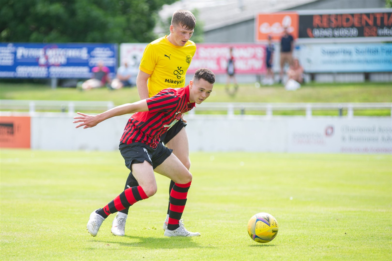 Elgin City's Dylan Lawrence holds off Nairn County's Cohen Ramsay...Elgin City FC (3) vs Nairn County FC (0) - Preseason Friendly - Borough Briggs, Elgin 17/07/2021...Picture: Daniel Forsyth..