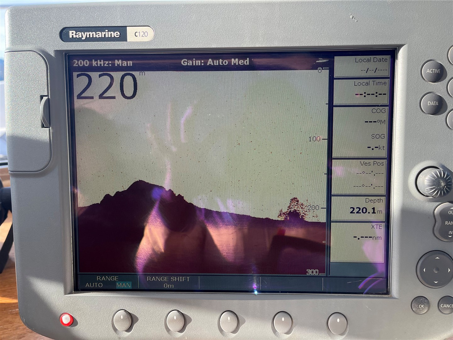 The radar screen showing mystery reading to the right, 220.1 metres down on loch bed.