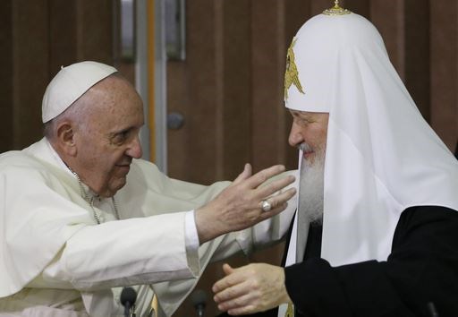 The Pope reaches to embrace Russian Orthodox Patriarch Kirill after signing a joint declaration in Cuba in 2016 (Gregorio Borgia/AP)