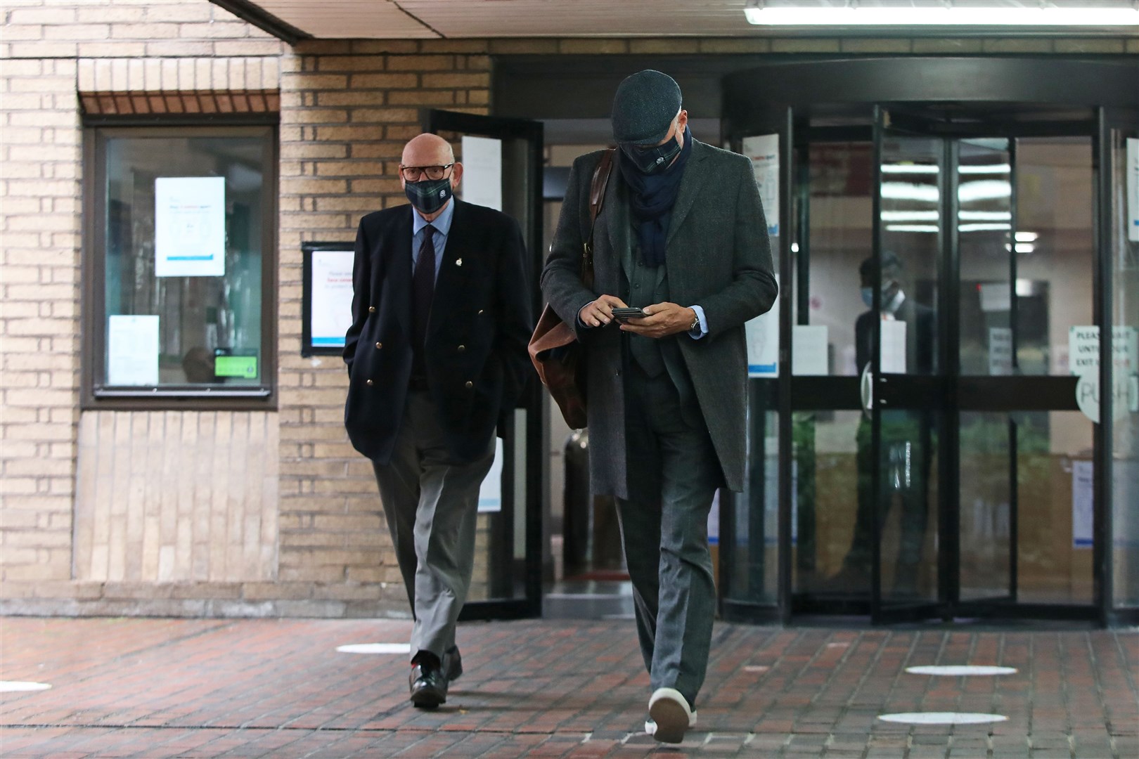 Former Blue Peter presenter John Leslie, 55, with his father Lesley Stott, leaving Southwark Crown Court in London (Luciana Guerra/PA)