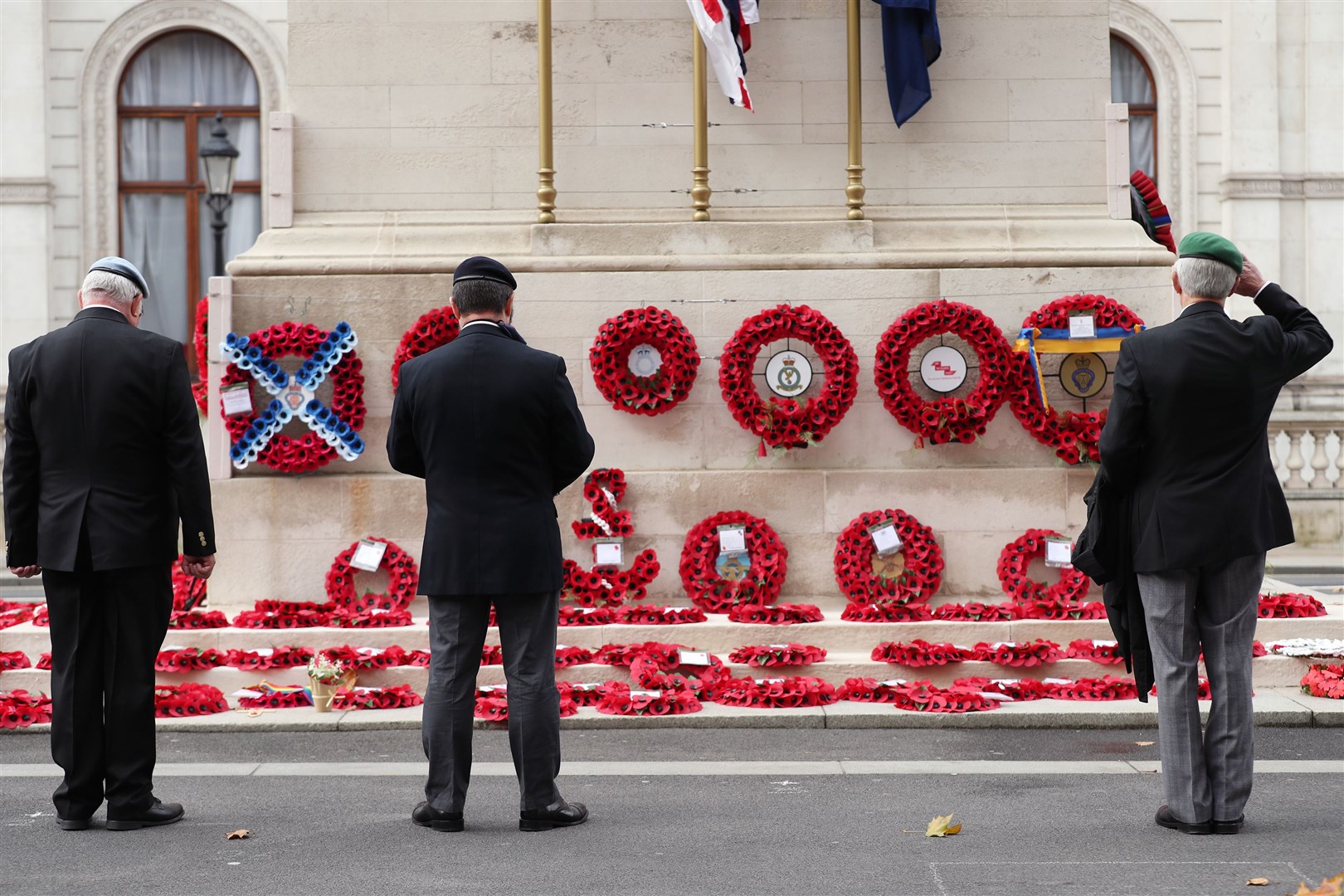 Members of the armed services pay their respects at the Cenotaph on Whitehall (Yui Mok/PA)