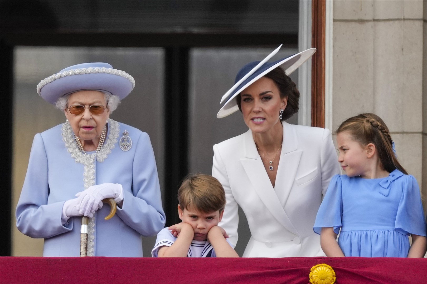 The Queen, Prince Louis, the Duchess of Cornwall and Princess Charlotte on the balcony of Buckingham Palace (PA)