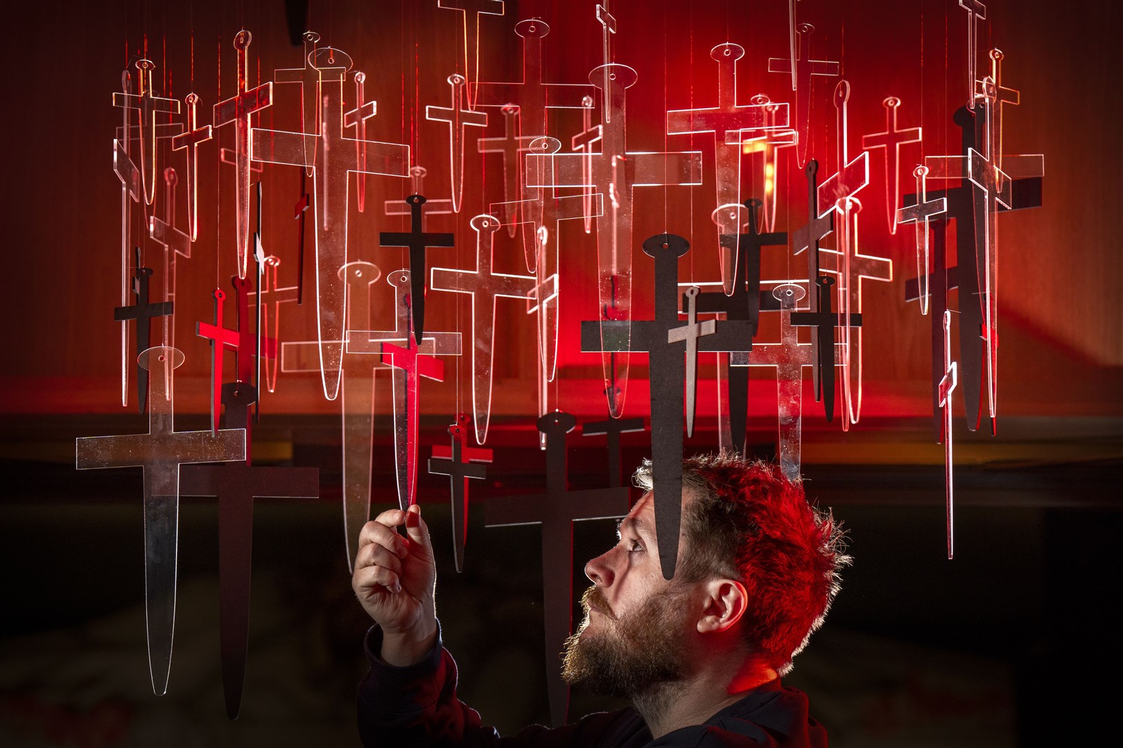 David McLeod puts the finishing touches to an installation featured in the exhibition (Jane Barlow/PA)