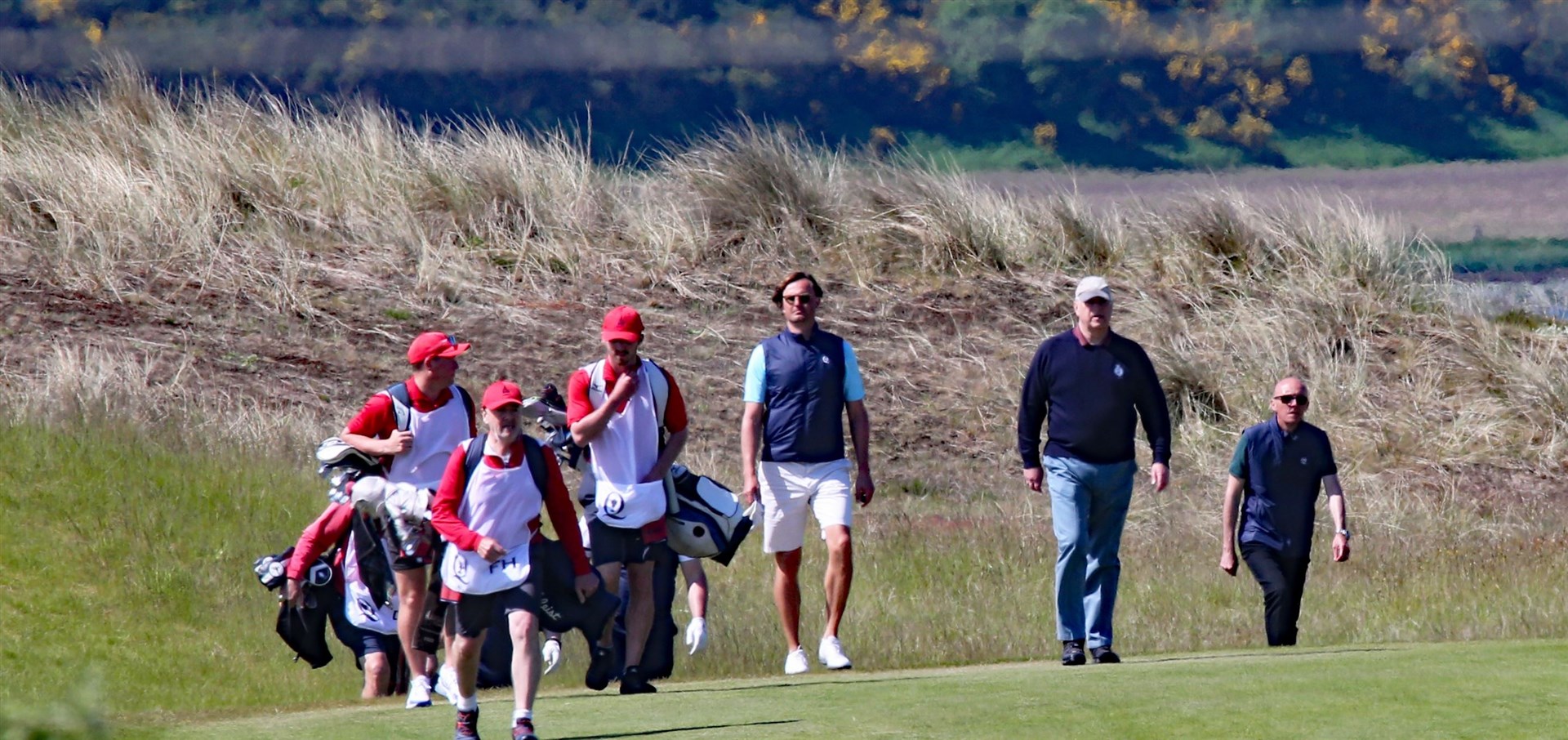Prince Andrew on the fairway second from right.