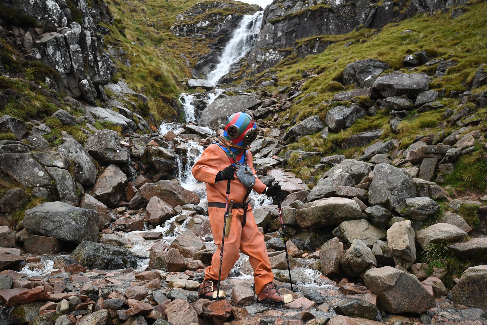 Lloyd Scott crosses a waterfall on Ben Nevis (Joe Giddens/PA)