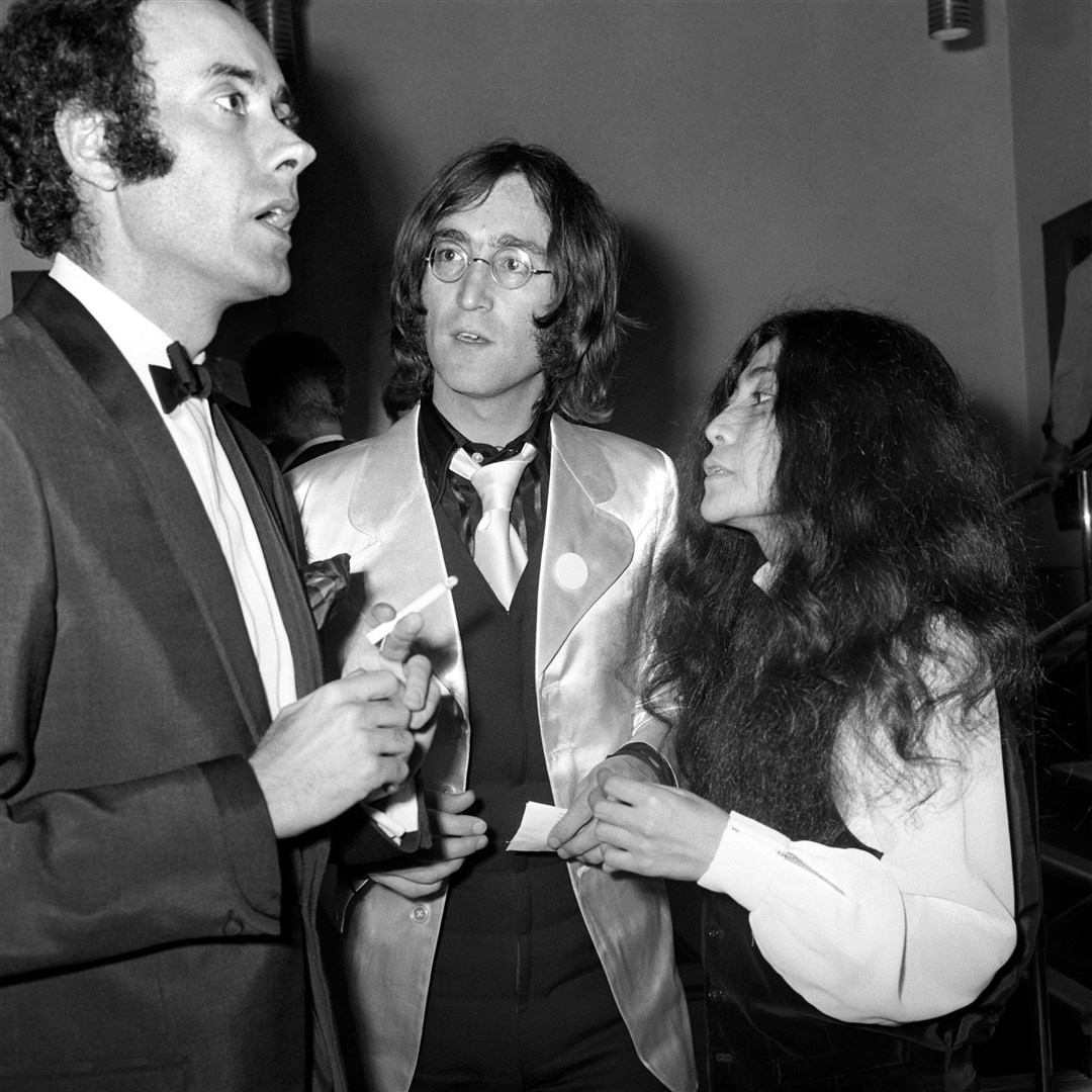 Actor Victor Spinetti (left) John Lennon and Yoko Ono at the first night of Lennon’s first play at The Old Vic National Theatre in London in 1968 (PA)