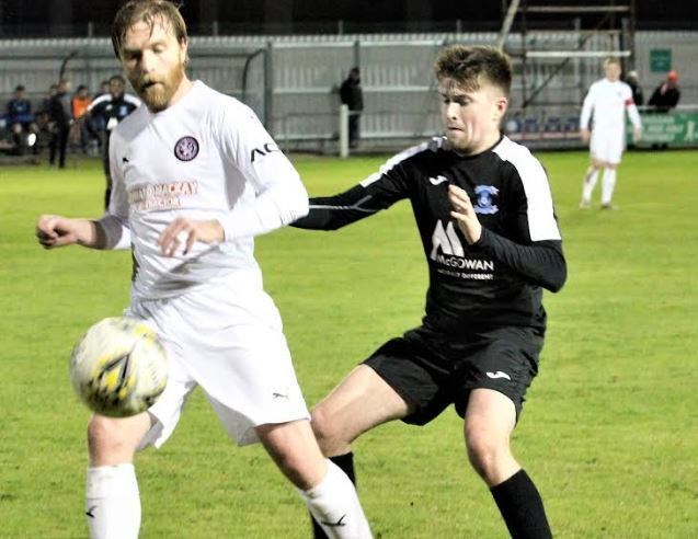 Strathspey Thistle's Liam Grant (right) competes for the ball during last night's heavy defeat to Brora.