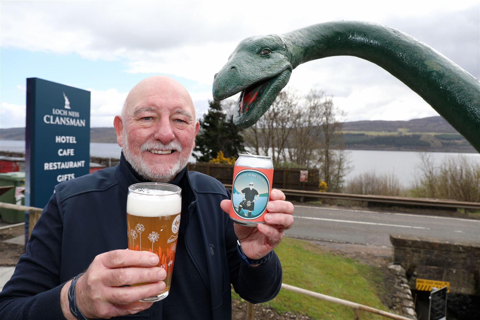 Willie Cameron on Loch Ness-side with the new ale and model "monster." Pic Peter Jolly