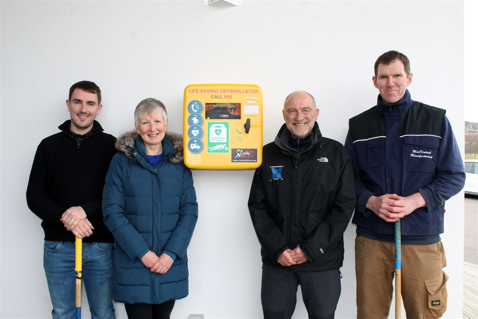Safely installed: The new defibrillator will serve the community say Isla Russell, Ian Jones and Newtonmore Shinty Club's Michael Russell and Fraser Mackintosh.