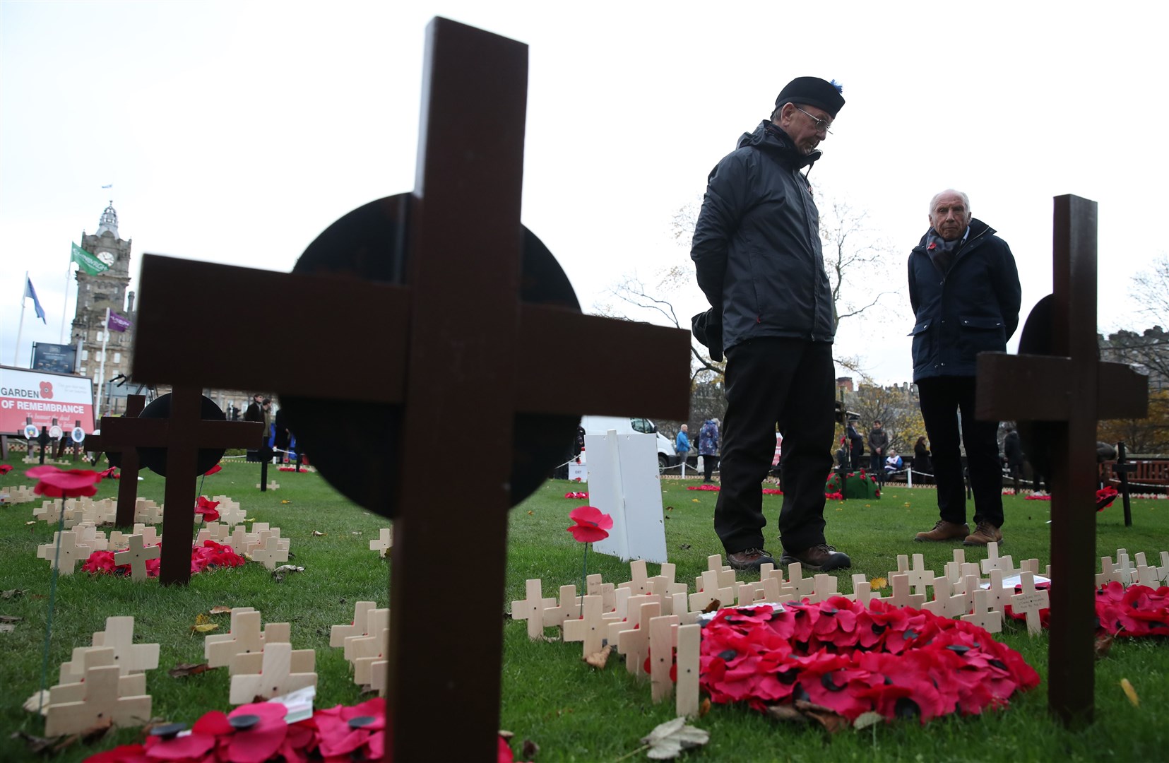 Members of the public and veterans pay their respect at the War Memorial Tribute Garden in Edinburgh (Andrew Milligan/PA)