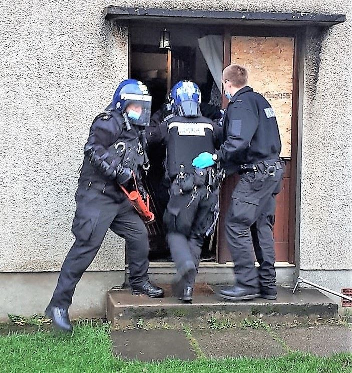 Police during a previous raid.