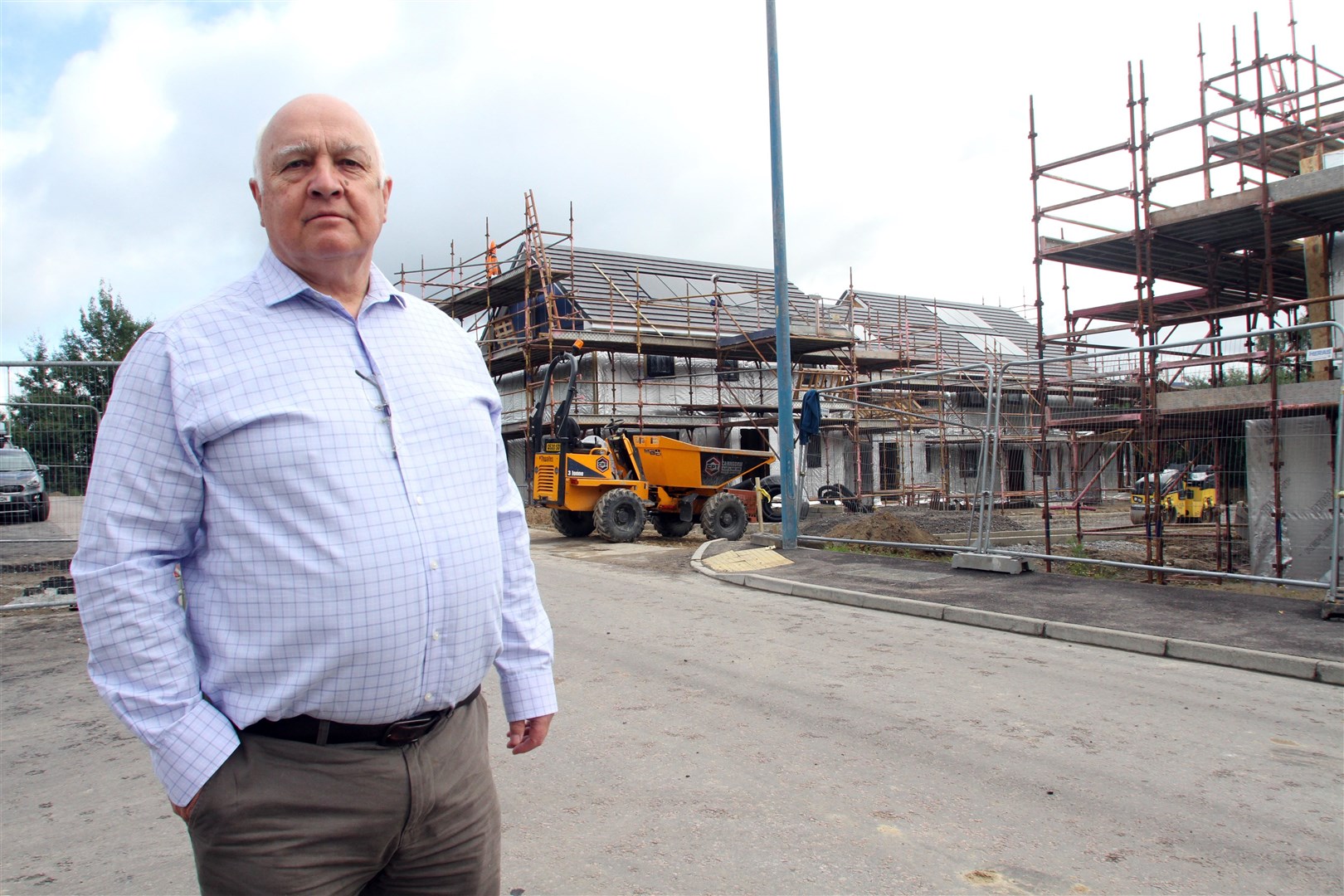 Counncillor Bill Lobban has been instrumental in the strath breaking new ground in a bid to stop so my homes being sold and used for short term lets. He is pictured here in front of an affordable homes development being built by the new hospital in Aviemore.