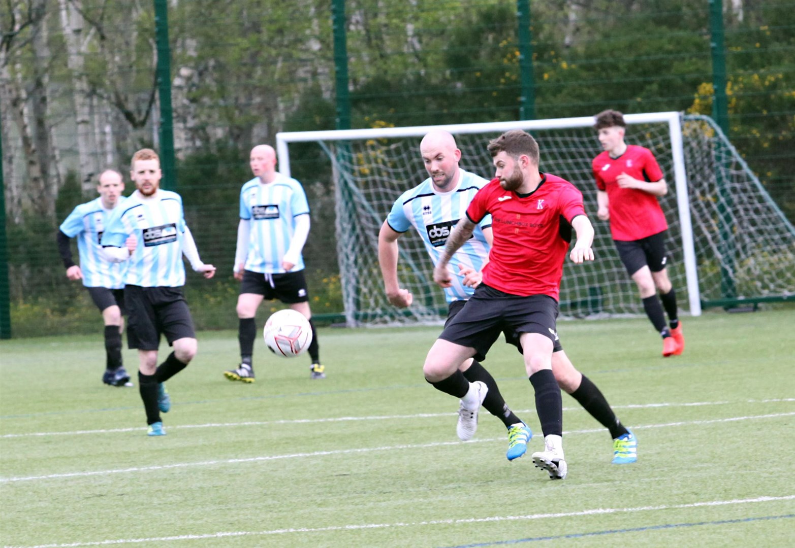 Kingussie (in red) have returned to welfare football after a seven-year break.