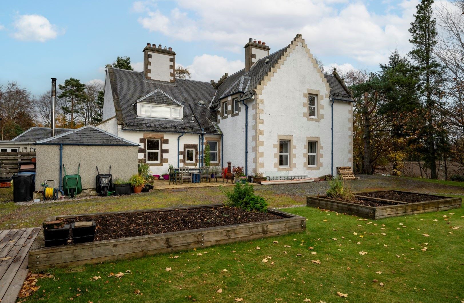 The Dower House is set in its own extensive grounds complete with planters and outbuildings.