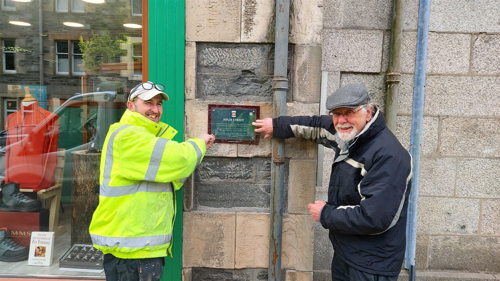 Bill Sadler (right) and Lee Grant in the High Street. Plaques have also been erected at locations including the Garth Hotel, Court House, The Square, Morlich House, Grant Arms Hotel, Church Avenue. Speyside House and the skating pond.