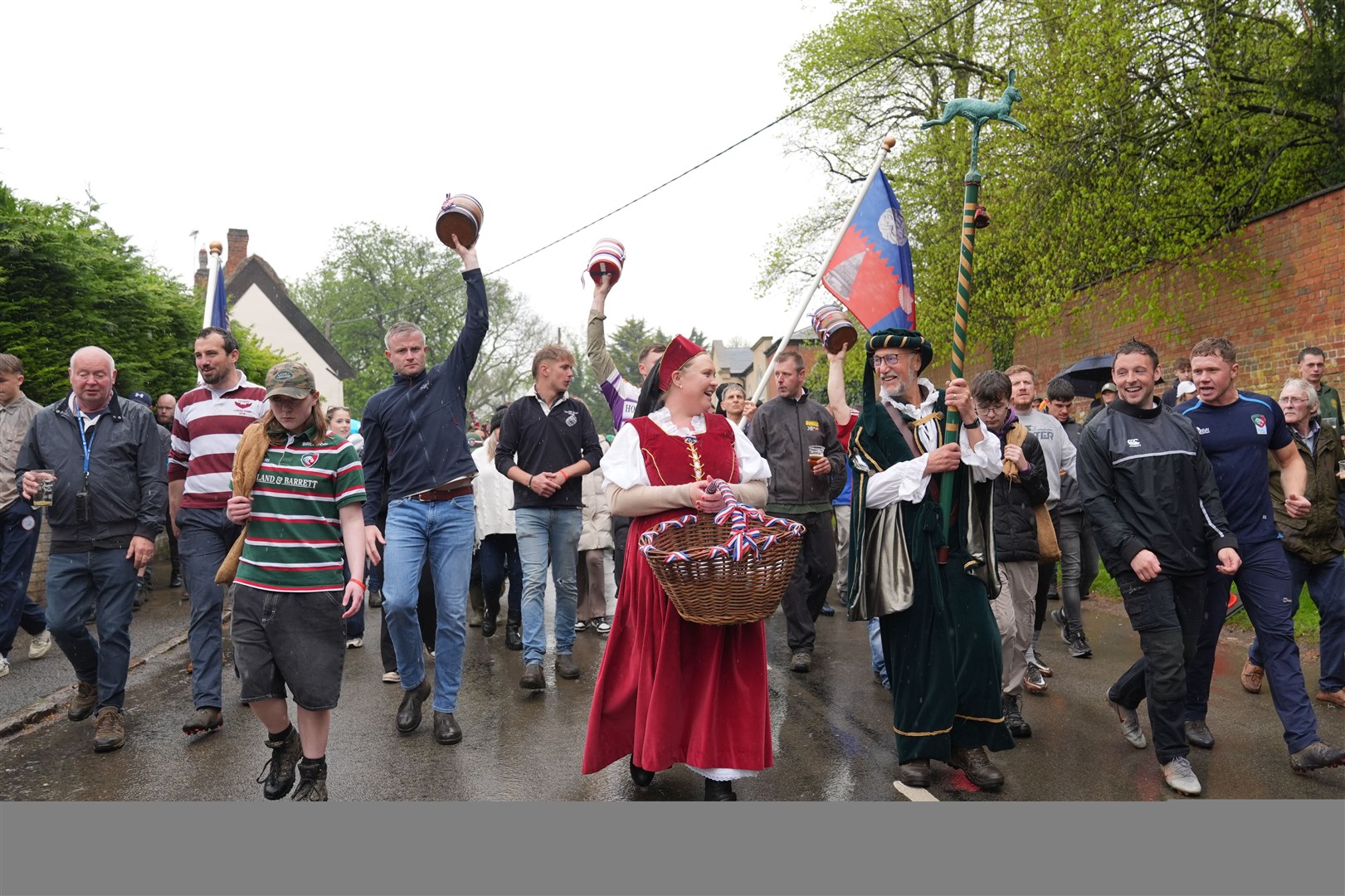 A hare pie was paraded to the church gates ahead of the annual bottle kicking (Joe Giddens/PA)