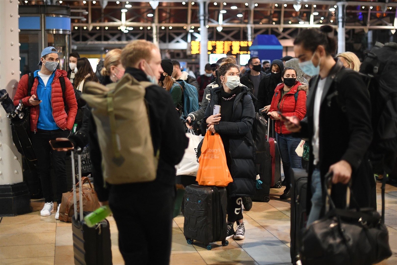 People at Paddington Station in London after the Tier 4 Covid restrictions are announced (Stefan Rousseau/PA)