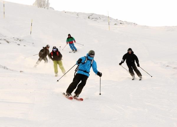Skiers enjoy the snow for the first time this season at CairnGorm Mountain