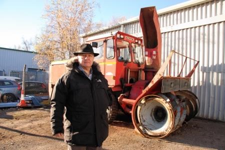 Councillor Lobban by the old snow blower at the council depot in Aviemore