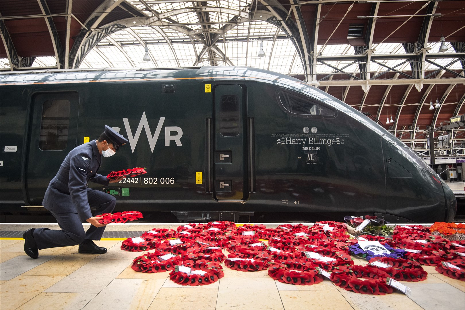Military personnel carry poppy wreaths at Paddington Station in London, for Poppies to Paddington which transported wreaths from around the UK into the station (Victoria Jones/PA)