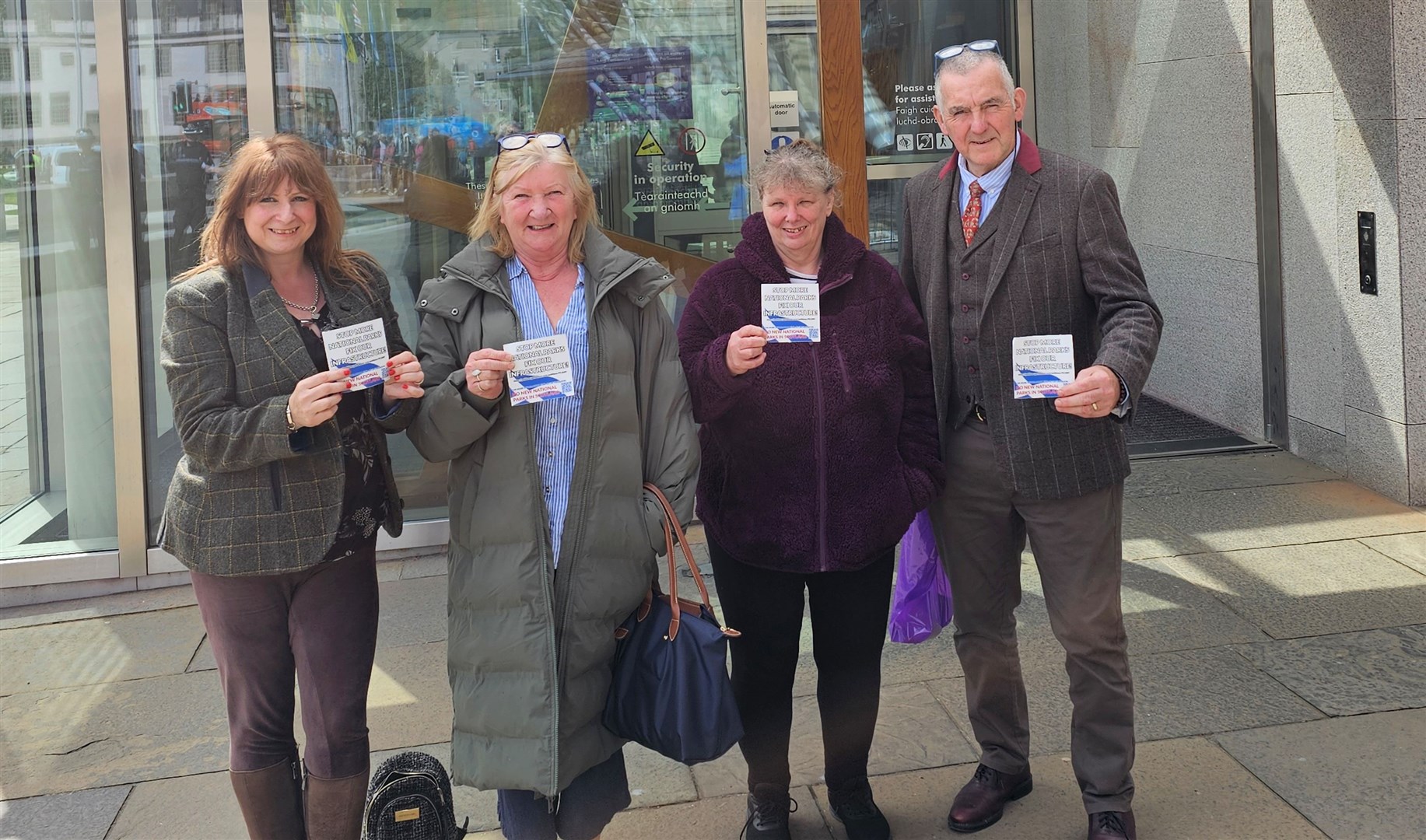 Lochaber National Park NO More campaign leader Deborah Carmichael (left) with LNPNM representatives at The Scottish Parliament.
