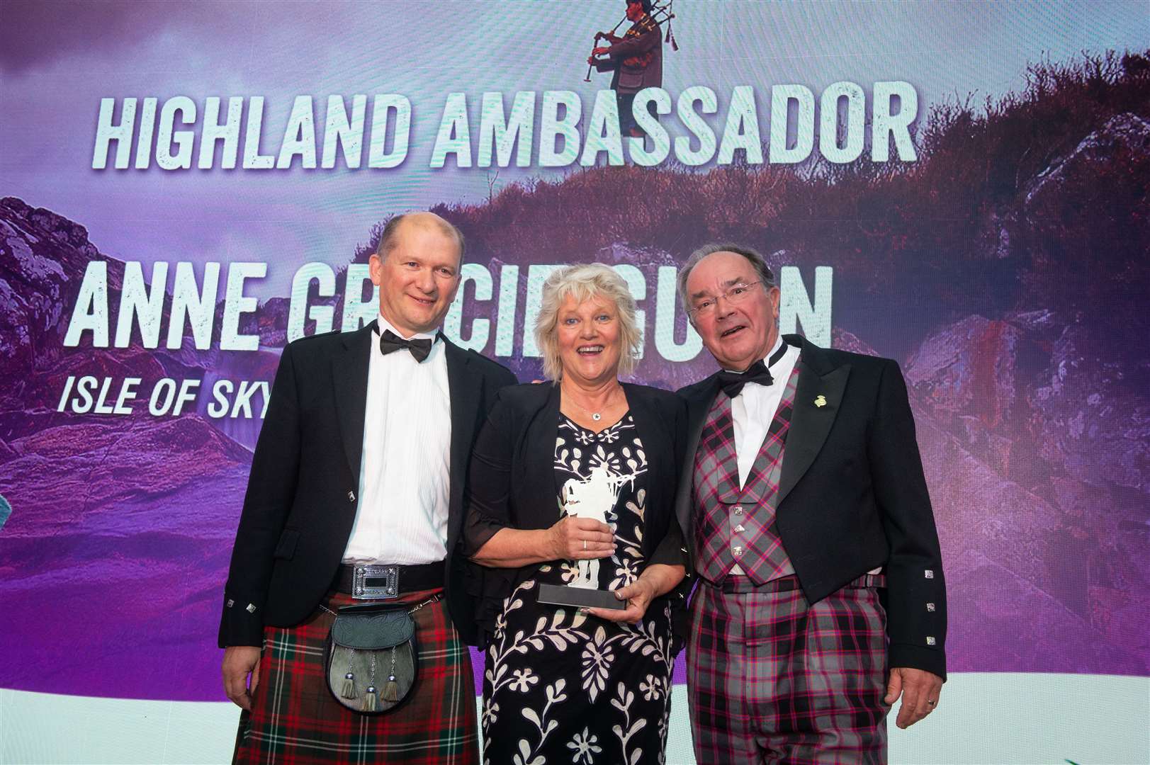 The 2019 Highland Ambassador was Anne Gracie Gunn. She received the award from sponsor, Mike Seaton, director of development, SSE Renewables and Laurence Young, HITA chairman. Picture: Callum Mackay