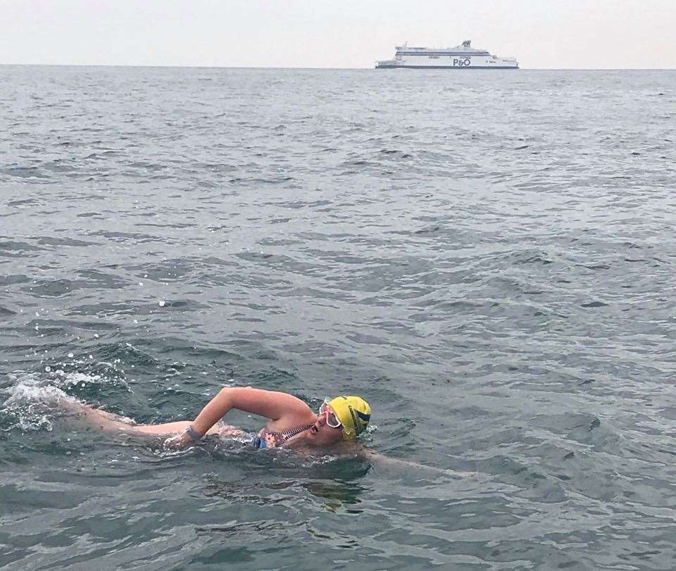 It's behind you. Sarah Wiseman in midstroke with a P&O ferry heading towards the south coast of England.