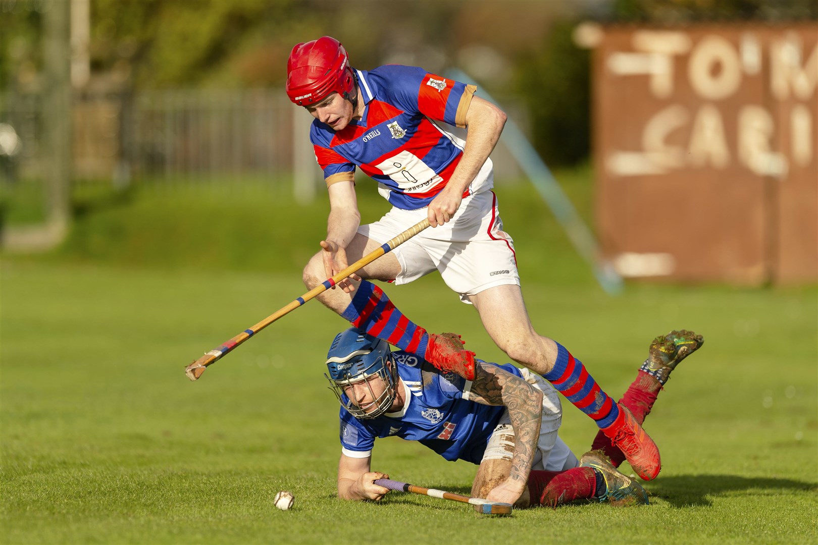 Kingussie's Calum Grant gets the better of Roddy Macdonald (Kyles) in the end of season game.