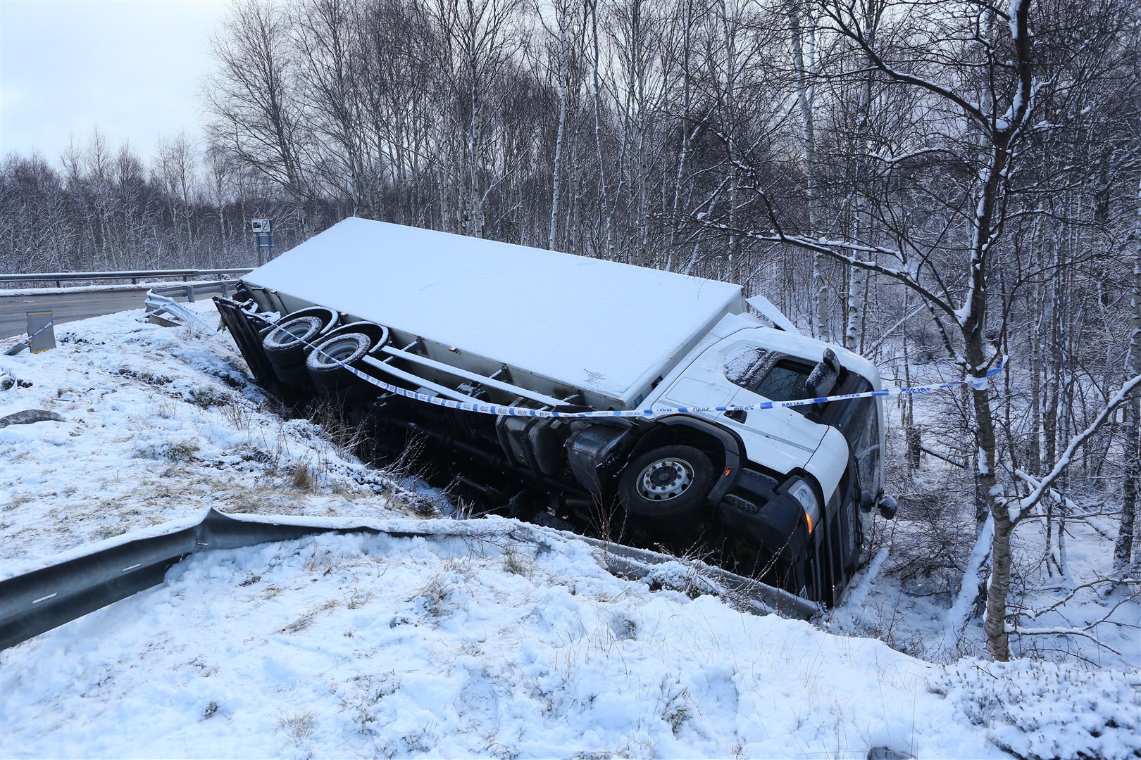 An HGV lorry which had crashed off the A9 at the Aviemore junction due to the snow and ice on the road. There were no reports of any serious injury. A police spokesperson told the Strathy: "Around 5.20am, officers were called to a report of a road crash involving one lorry on the A9 near Aviemore. Officers attended to assist." Picture: Peter Jolly