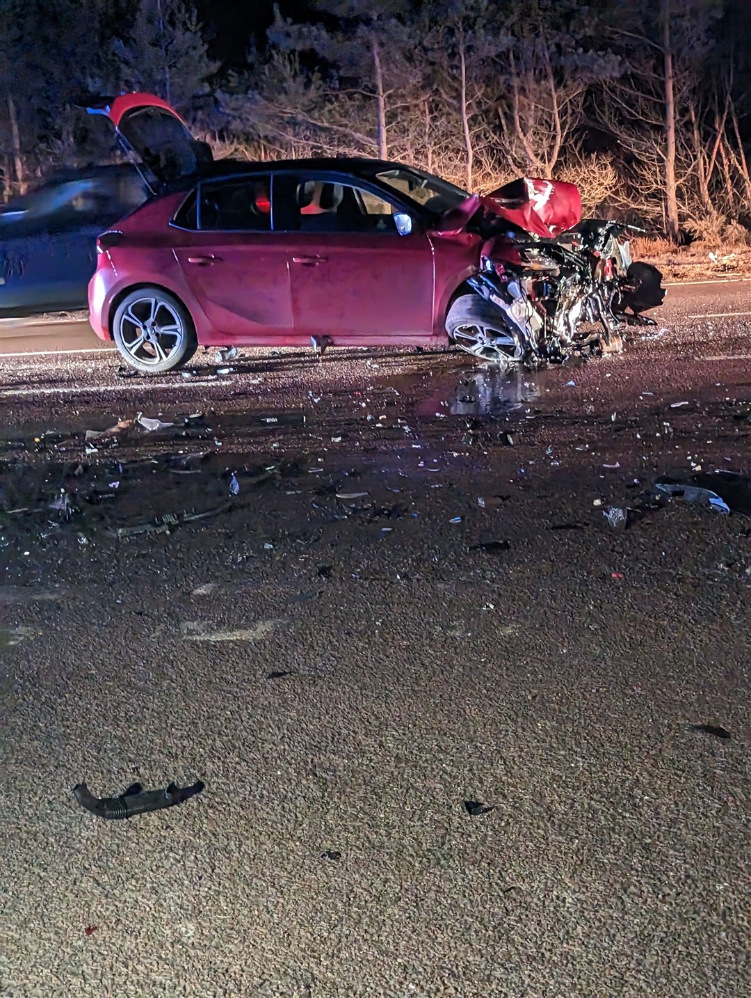 The front of the car suffered significant damage and debris was scattered over the carriageway.