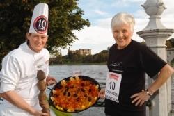 Baxters chef Darren Sivewright with 10th anniversary Loch Ness Marathon runner Margaret Woodhouse (of Inverness) sampling the food on offer at the Baxters Food & Drink Fayre, part of the Event Village at the Baxters Loch Ness Marathon & Festival of Runnin